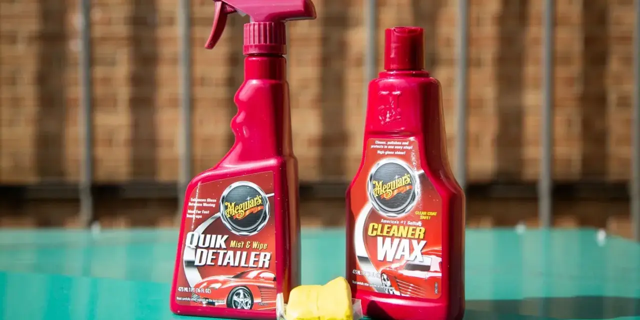 Car detailing supplies: Meguiar's Quik Detailer, Cleaner Wax, and a clay bar for a smooth finish.