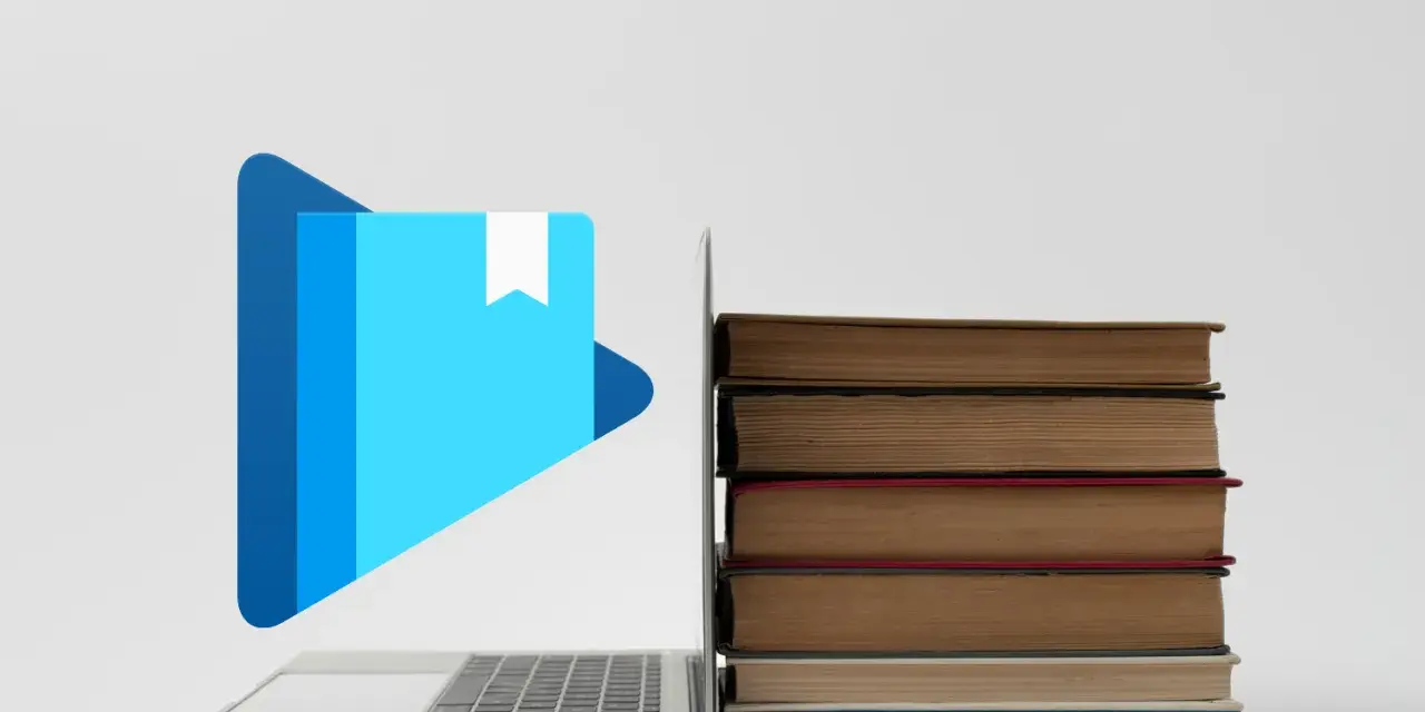 Laptop z ikoną książki i stosem książek. Jak otworzyć plik epub?