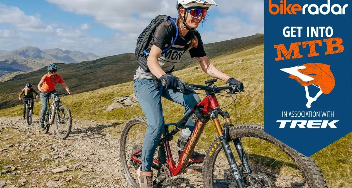 Three friends enjoy a sunny day of cross country biking on a rocky mountain trail, with a "Get Into MTB" logo in the corner.