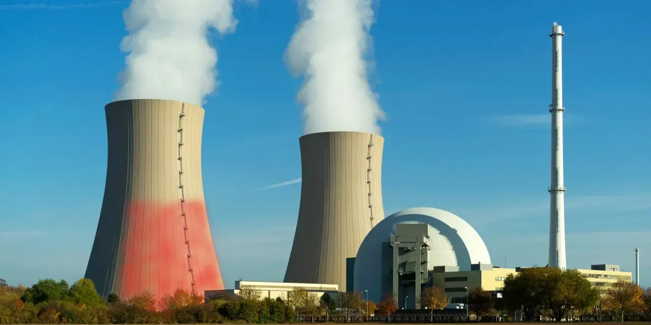 Dwie chłodnie kominowe i kopuła elektrowni atomowej, symbolizujące moc elektrowni atomowej w Polsce.