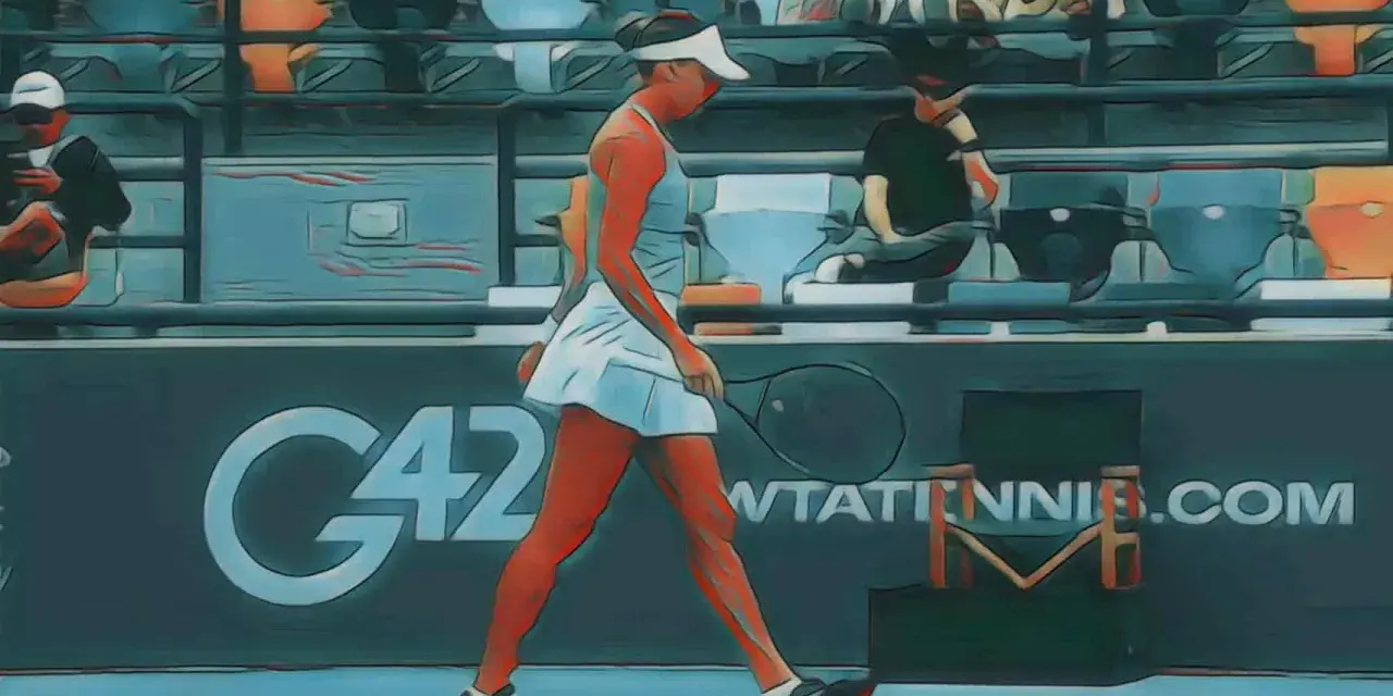 Tenisistka idzie po korcie, trzymając rakietę. Tło sugeruje turniej WTA Abu Dhabi 2026.