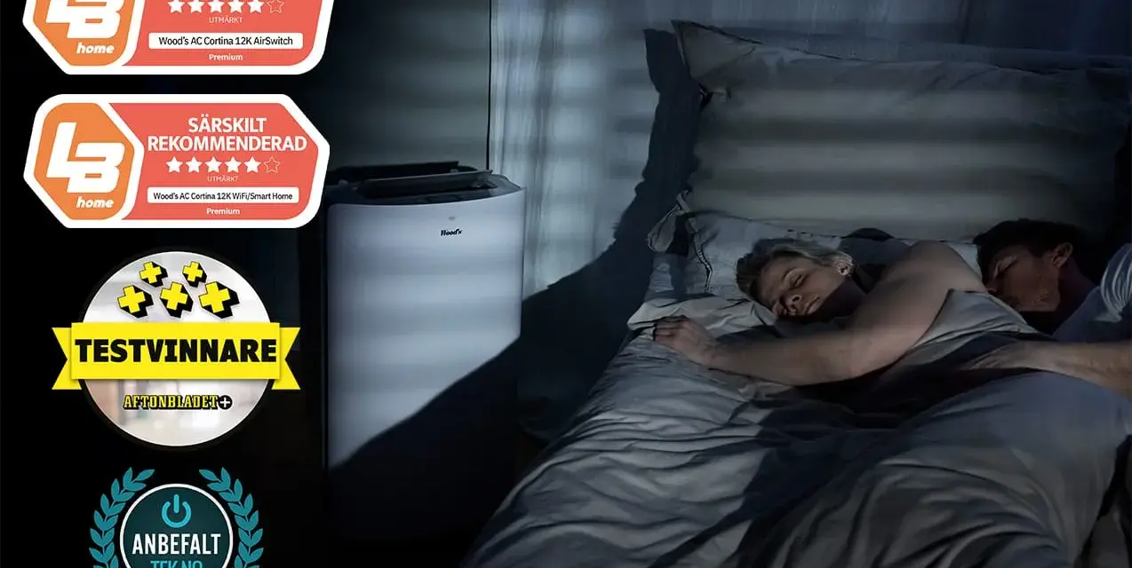 Ett par sover lugnt i mörkret medan en luftfuktare sovrum står bredvid sängen, med utmärkelser som "Bäst i test" och "Särskilt rekommenderad".