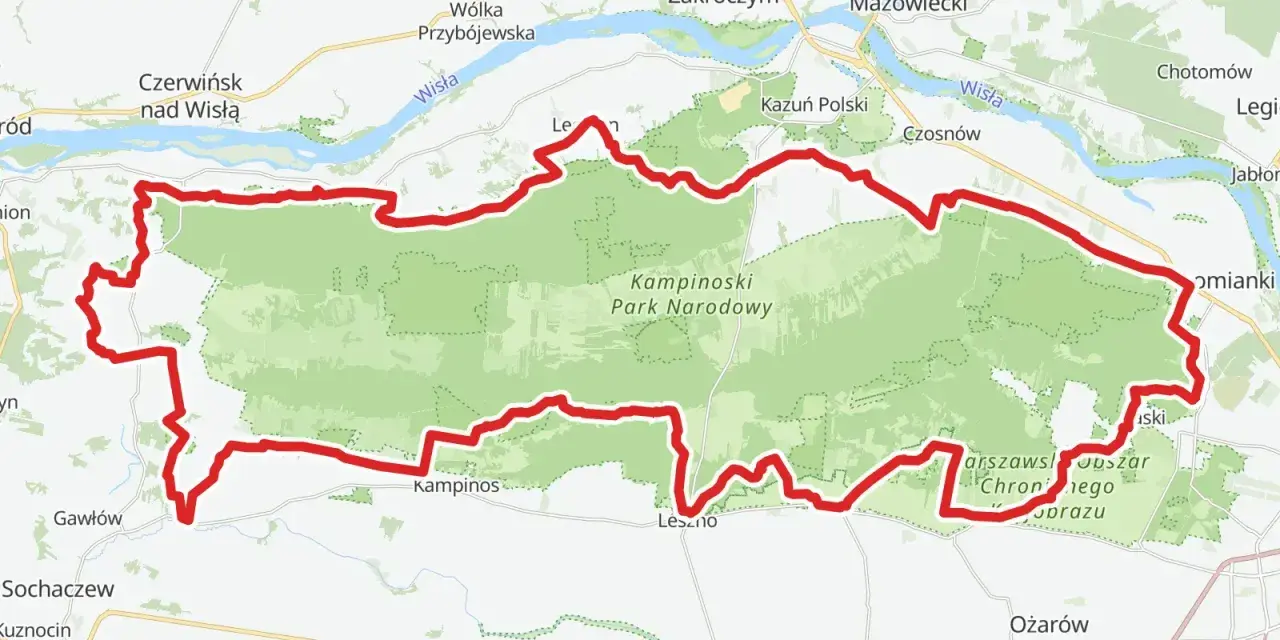 Mapa z zaznaczonym Kampinoskim Szlakiem Rowerowym, biegnącym przez Kampinoski Park Narodowy, w pobliżu Wisły i miejscowości takich jak Zakroczym czy Ożarów Mazowiecki.