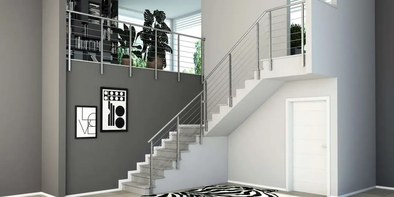 Moderne idee ringhiere scale interne in acciaio inox, con libreria a muro e quadri astratti.