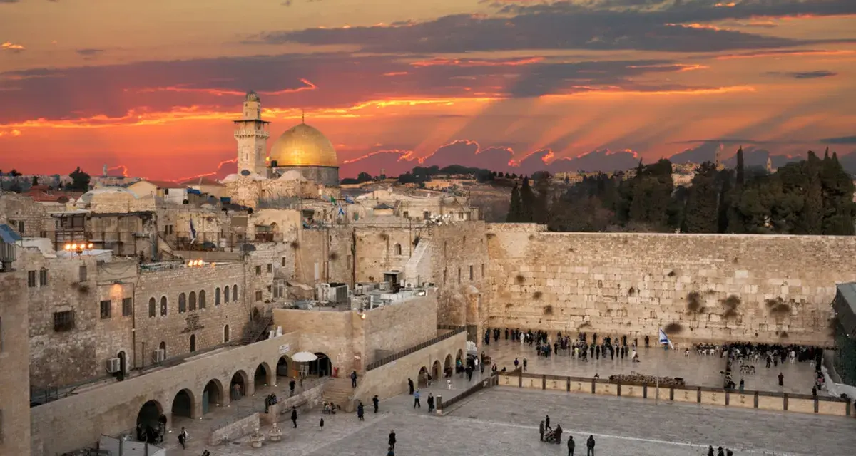 Sunset over Jerusalem's Old City, with the Dome of the Rock and the Western Wall, a glimpse of Solomon's Temple today.