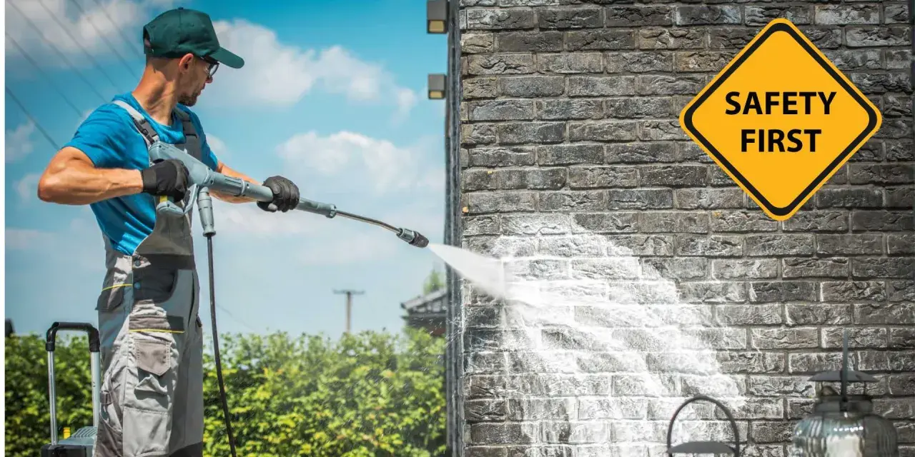 Man demonstrates how to use a pressure washer on a brick wall, with a "Safety First" sign visible.