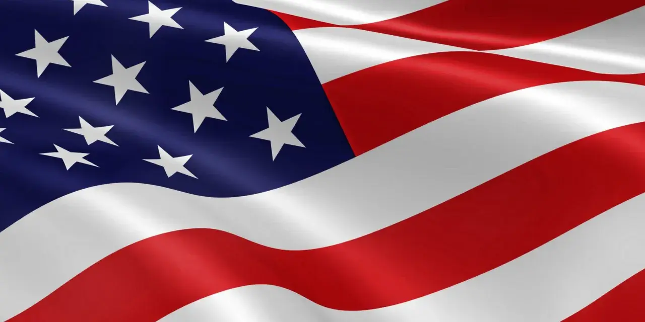 Flaga USA, z jej niebieskim polem i białymi gwiazdami, symbolizuje jedność. Ile gwiazdek ma flaga USA? 50, po jednej na każdy stan.