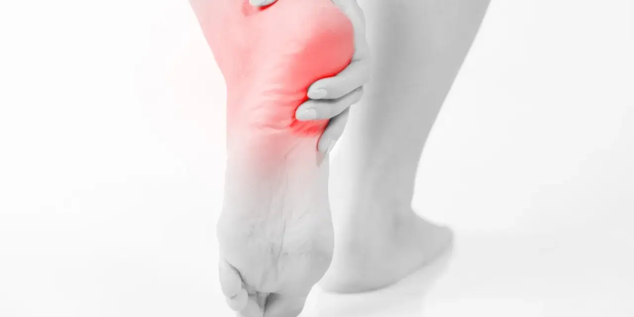 A person's foot with a red highlight on the heel, suggesting pain. This image evokes the relief of soaking an ankle in epsom salt.