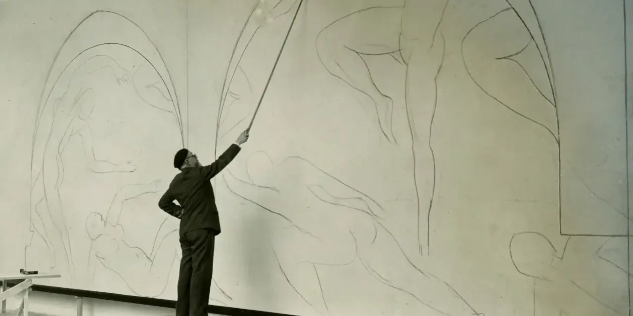 Henri Matisse, z laską w dłoni, kieruje pracami nad szkicem swojego słynnego "Tańca".