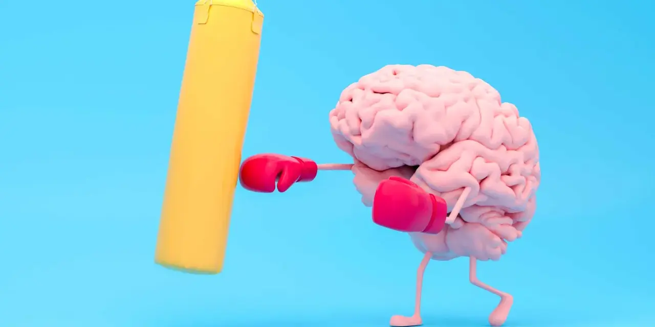 Cervello con guantoni da boxe rosa colpisce un sacco giallo, un modo per risollevare l'umore.
