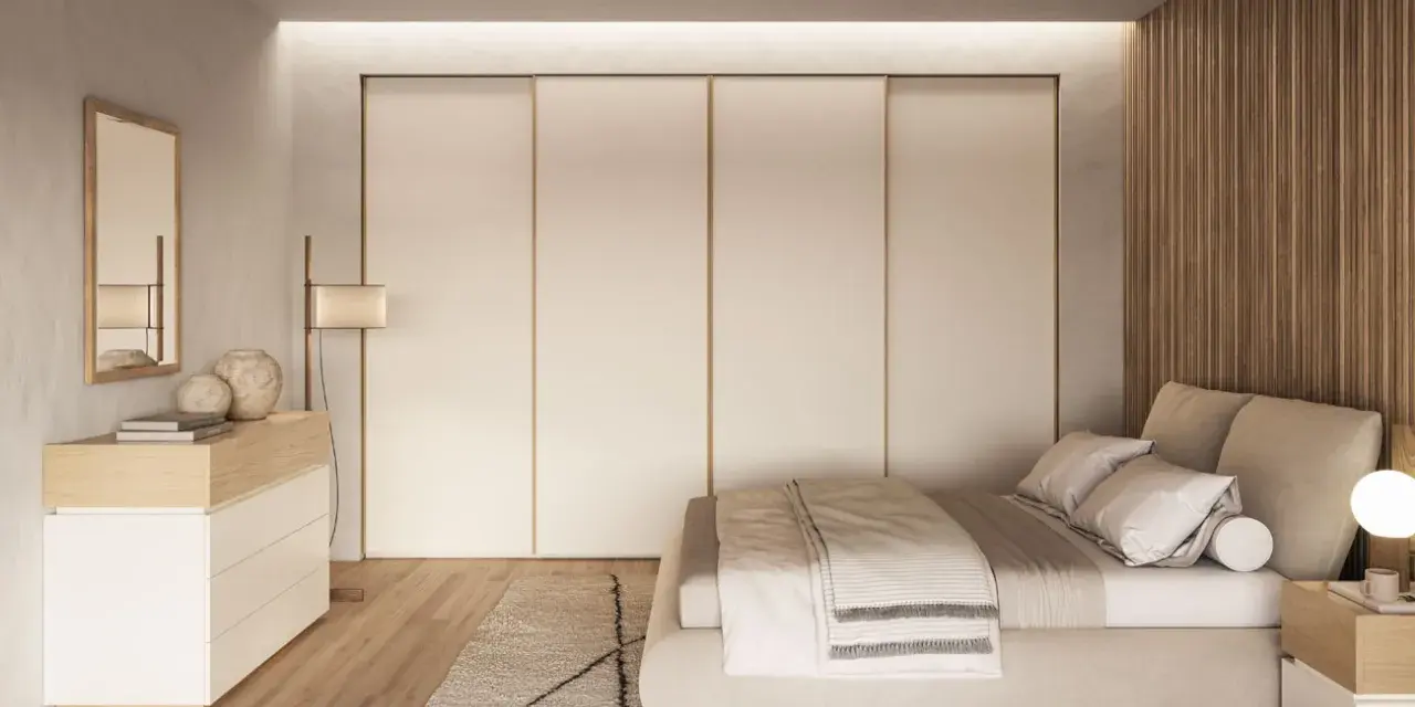 Camera da letto scandinava con letto accogliente, armadio a scomparsa e comò in legno chiaro. Un'oasi di pace in stile nordico.