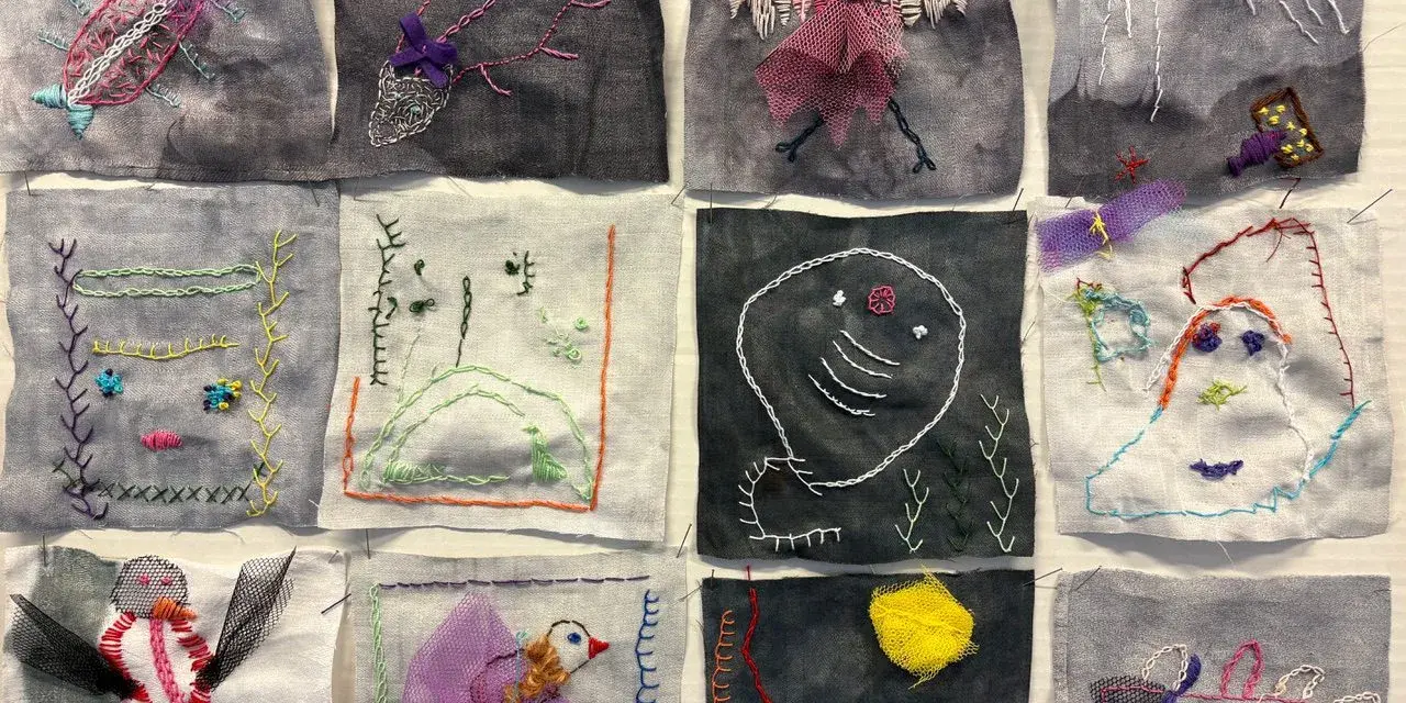 En bilduppgift vår med broderade figurer: insekter, fåglar, ansikten och abstrakta former på tygbitar.