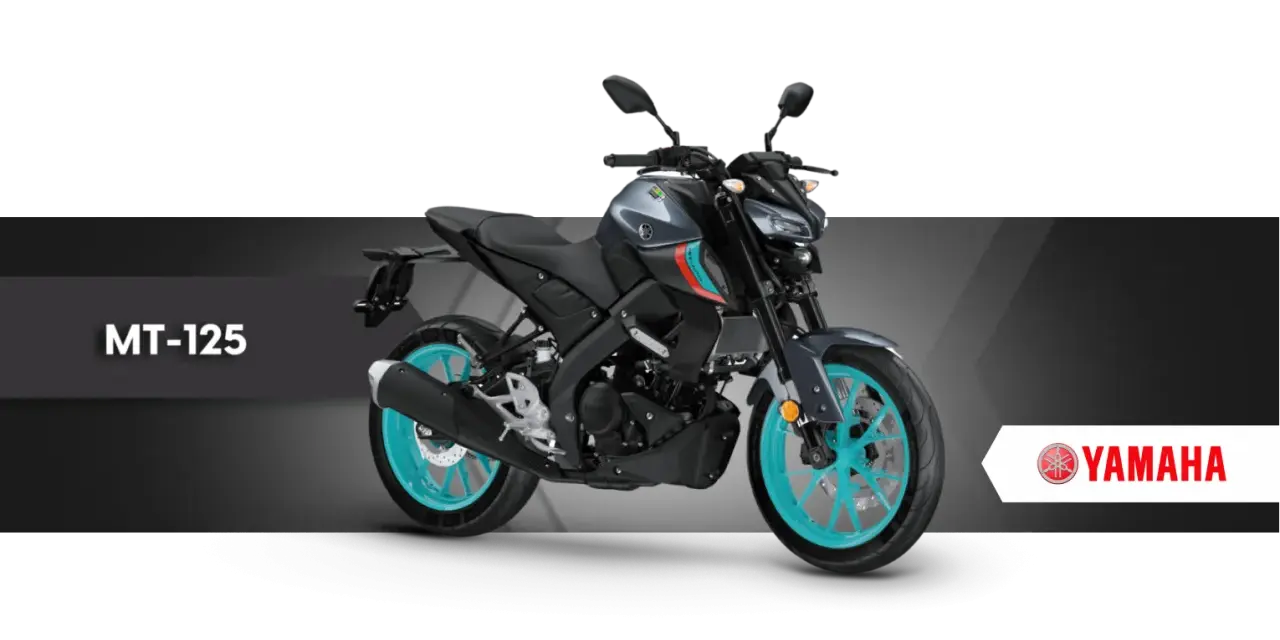 Szary motocykl Yamaha MT-125 z turkusowymi felgami, gotowy na miejskie przygody.