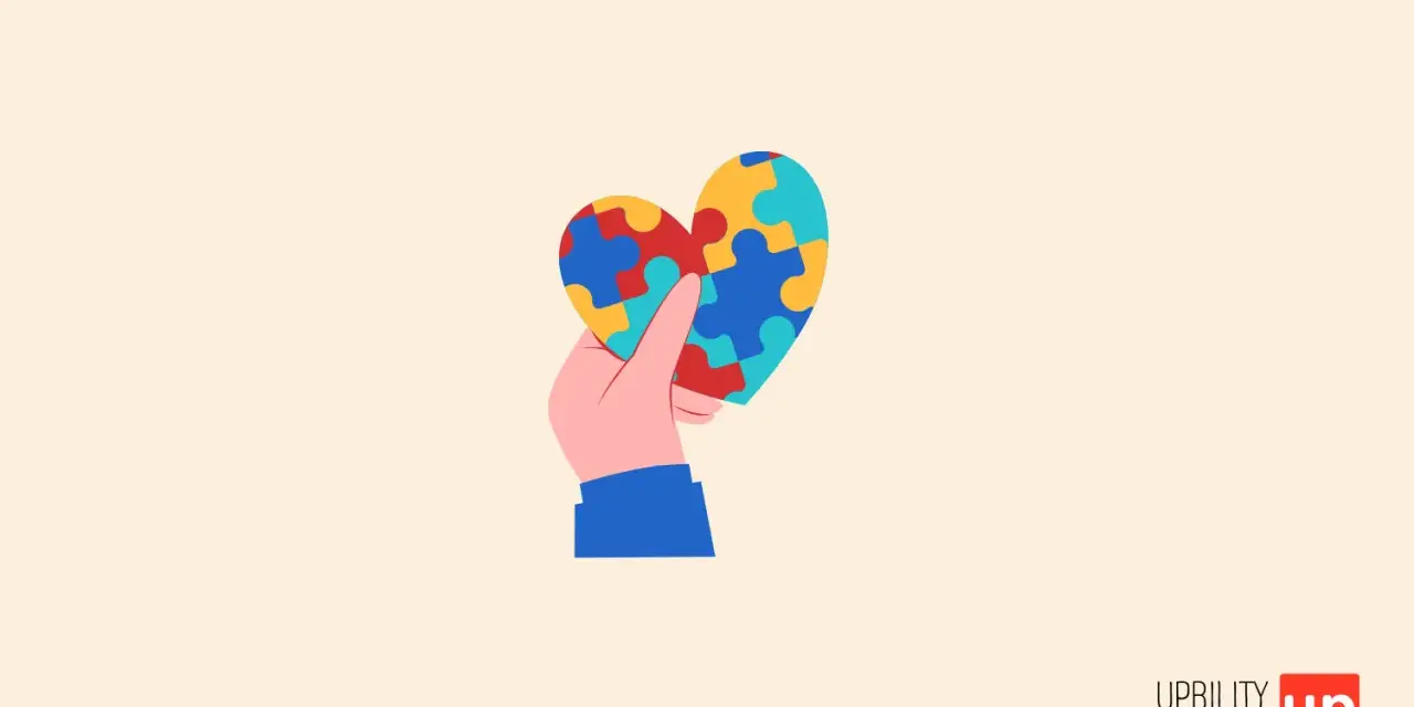 Mano che tiene un cuore a puzzle colorato, simbolo di comprensione e accettazione per l'autismo grado 1.