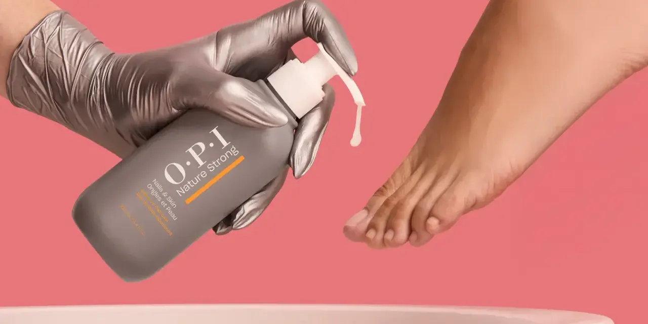 Gloved hand dispenses OPI Nature Strong Pedi Soak, preparing to soak feet for a luxurious pedicure.