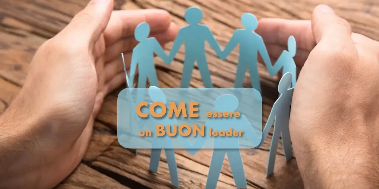 Mani che proteggono figure di carta unite, simboleggiano come delegare un proprio compito ad altri sia fondamentale per un buon leader.