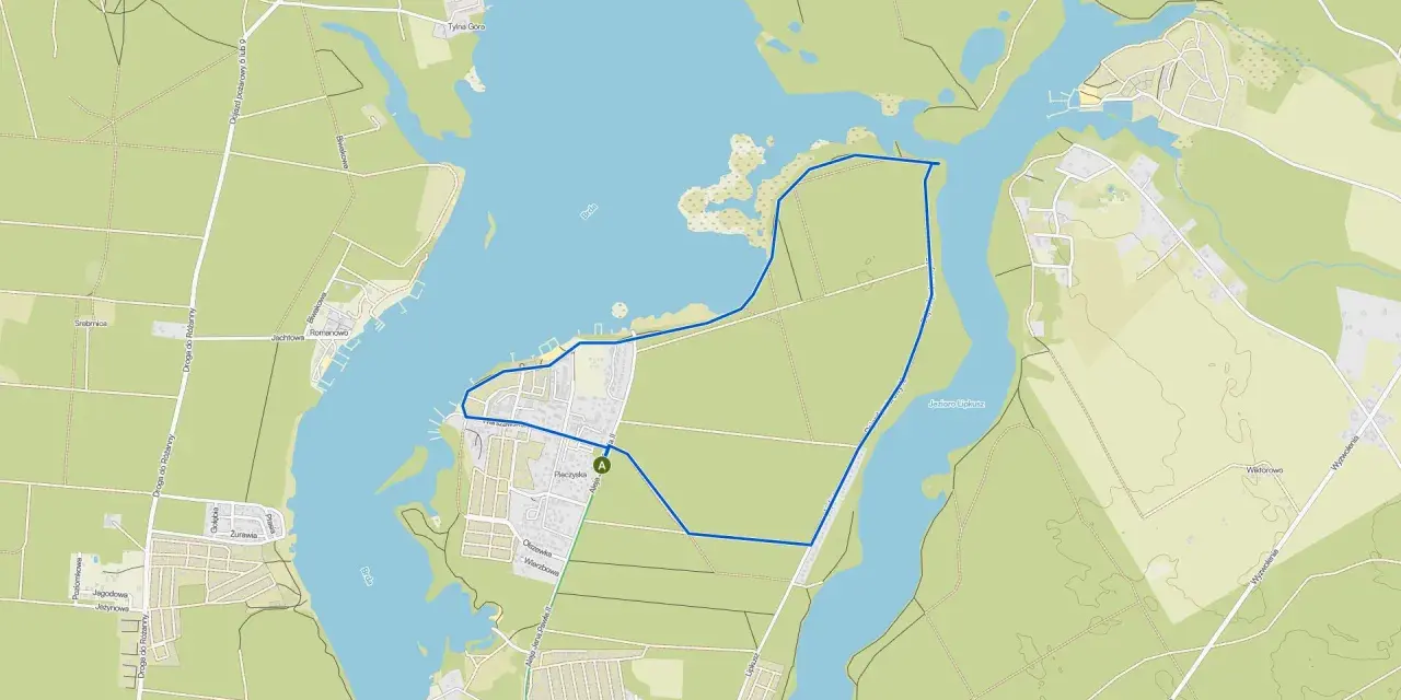 Mapa turystyczna z zaznaczoną trasą wokół **zalewu Koronowskiego**. Widoczne drogi, zabudowania i linie brzegowe.