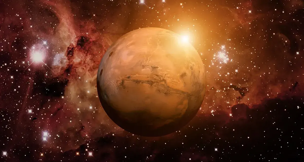 El planeta Marte brilla en el cosmos, rodeado de nebulosas y estrellas. Su superficie rojiza evoca la energía de una marte carta astral, guiando destinos.