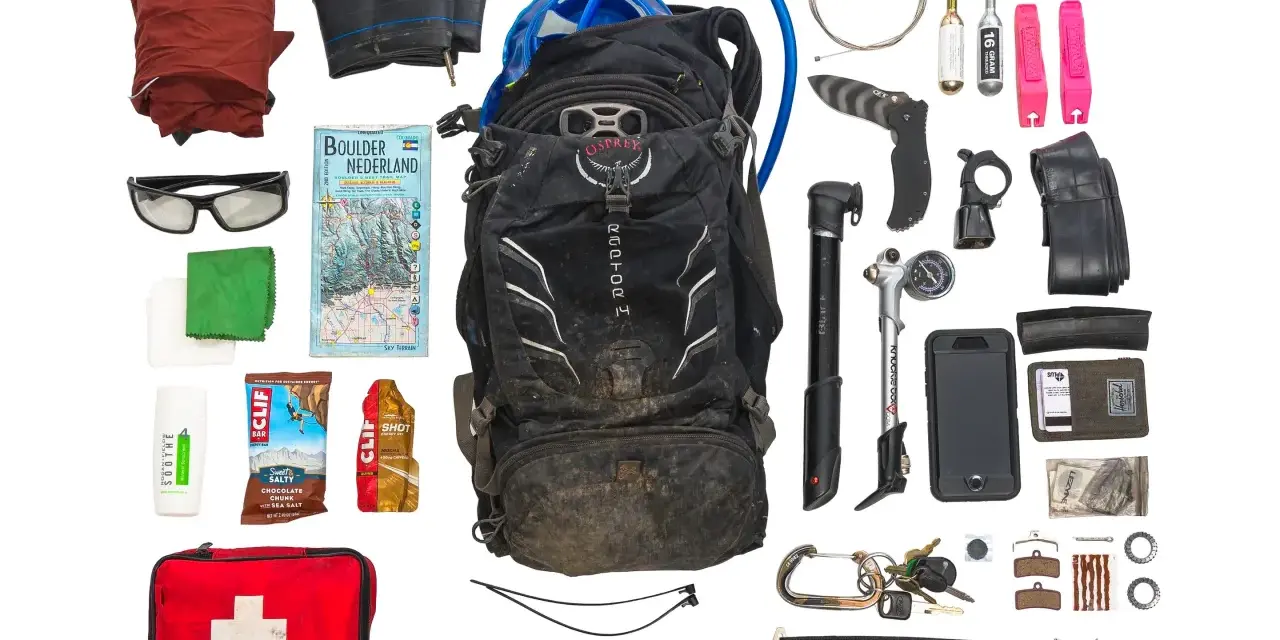 Essential mtb must haves for any adventure: backpack, pump, tools, spare tube, first aid, map, and snacks.