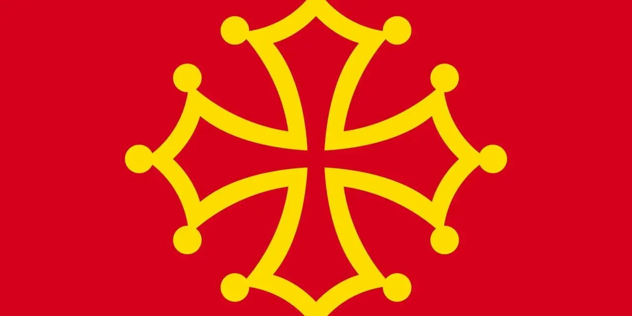 Bandera roja con una cruz amarilla de Occitania, símbolo de la lengua de oil hablada en regiones de Francia.