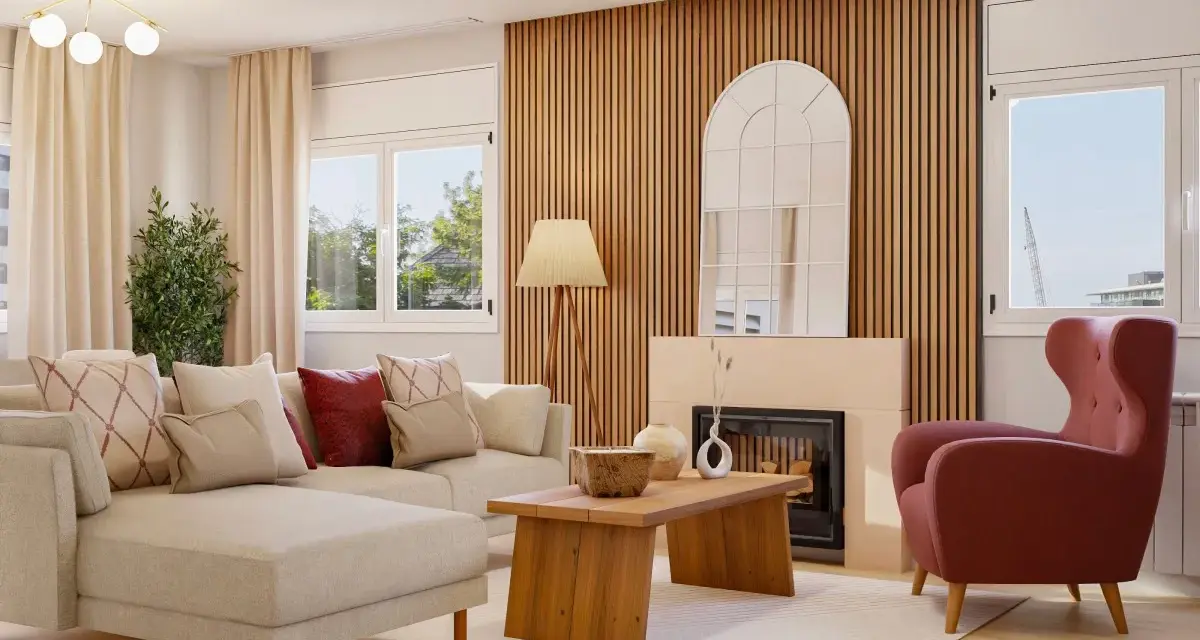 Sofá modular beige, sillón rosa, mesa de centro de madera y chimenea con espejo arqueado. Un espacio con un diseño aesthetic acogedor.