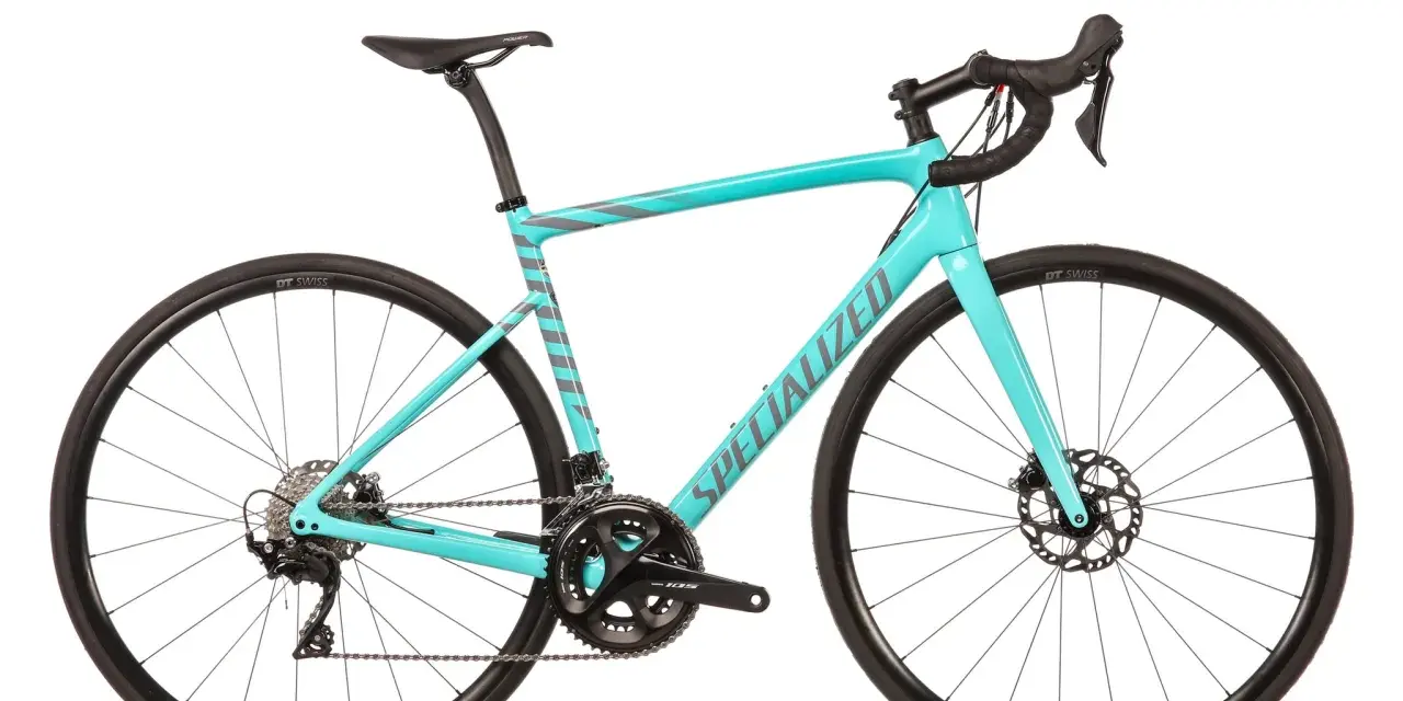 This turquoise Specialized road bike, with its sleek design and disc brakes, proves that specialized bikes are good for performance and style.