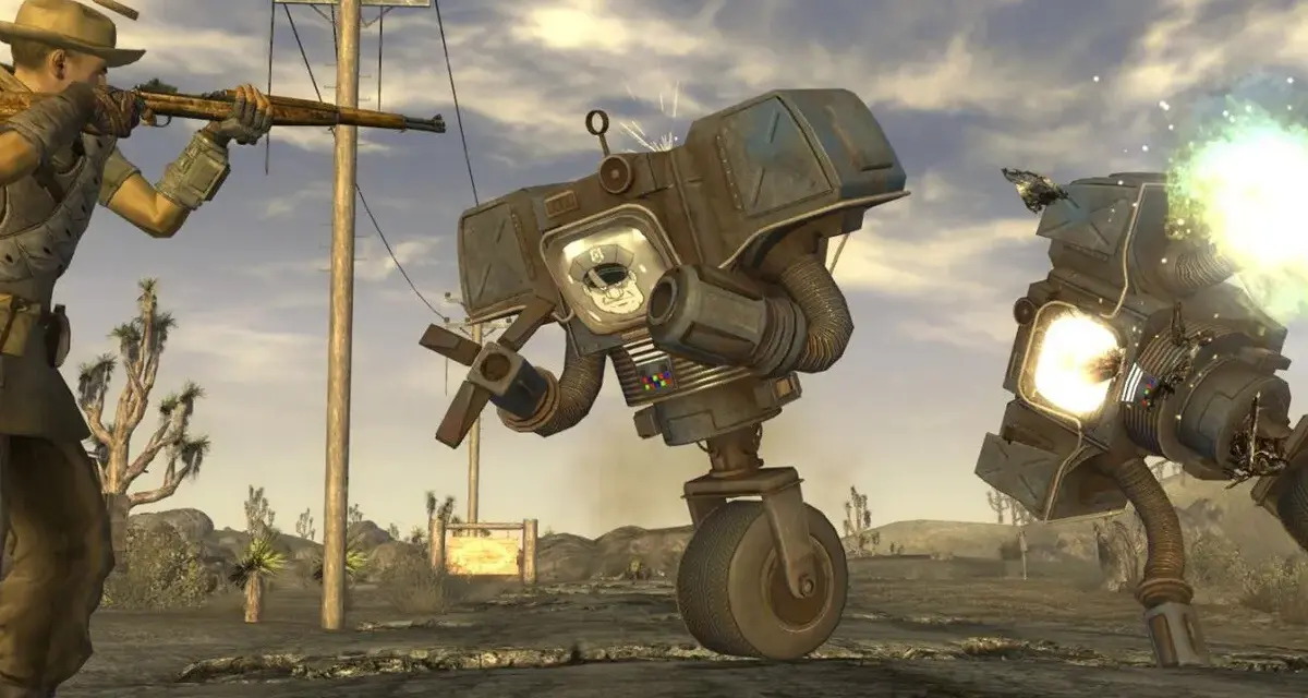 Un personaje con rifle dispara a robots en el desierto. ¡Descubre trucos de Fallout: New Vegas para sobrevivir!