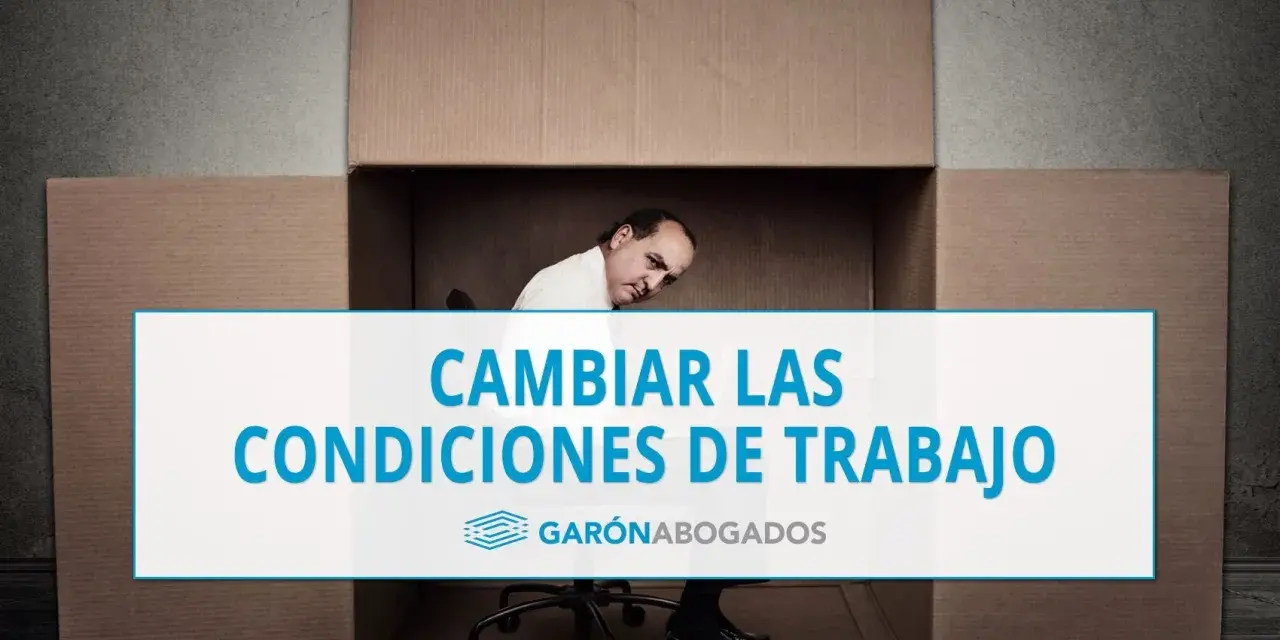 Hombre dentro de una caja de cartón, con texto "CAMBIAR LAS CONDICIONES DE TRABAJO". Posible referencia al art. 41 ET.