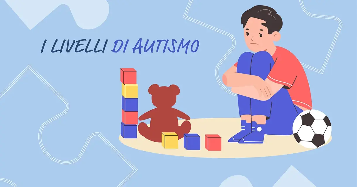 Un bambino con autismo livello 2 gioca con blocchi e un orsacchiotto, mentre un pallone da calcio è vicino.