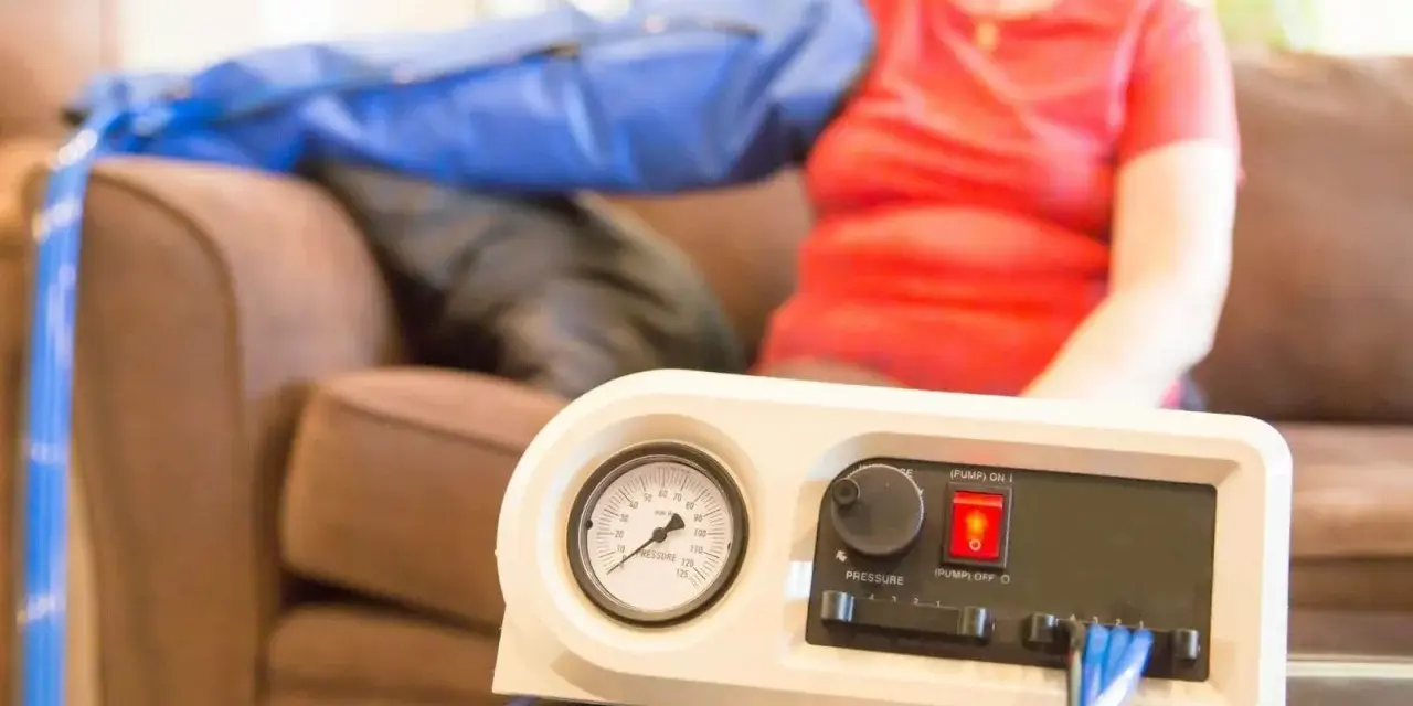 A person uses a lymphedema pump on their arm. Consult your doctor about how often you can use your lymphedema pump.