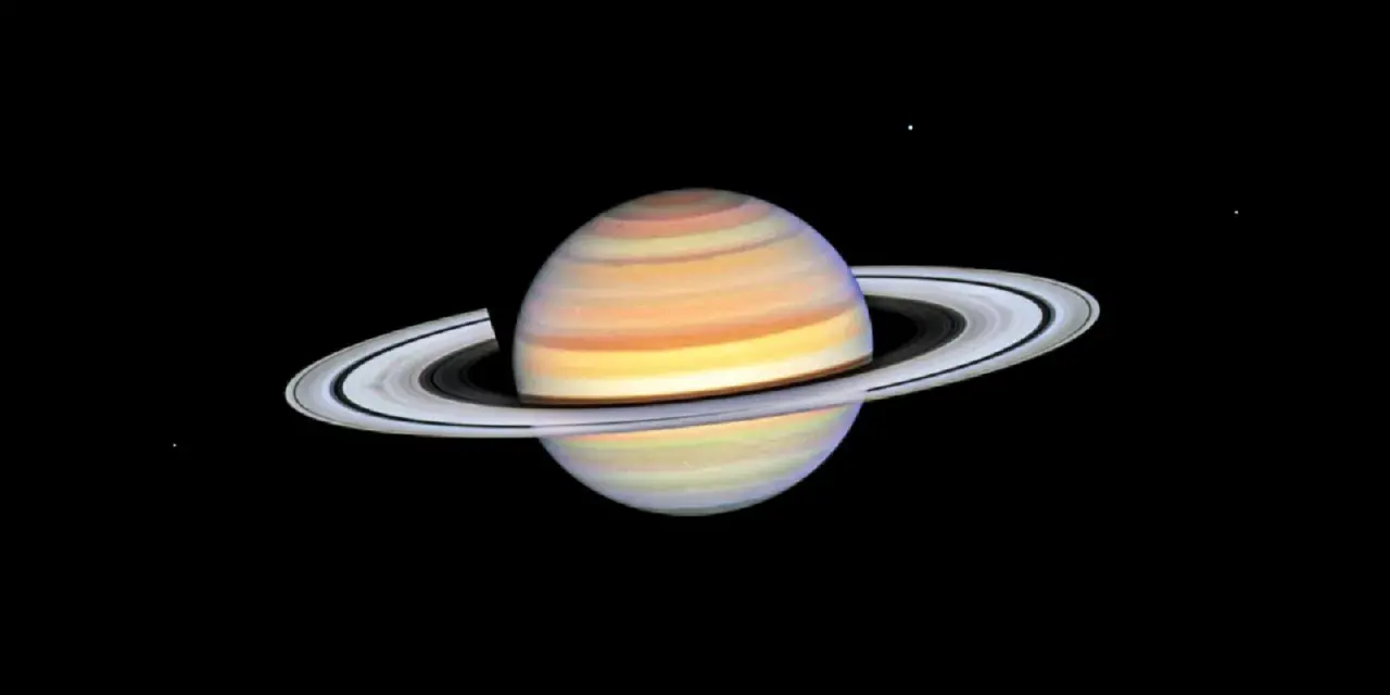 Saturn w Byku, majestatyczny gazowy olbrzym z pierścieniami, unoszący się w kosmicznej pustce.