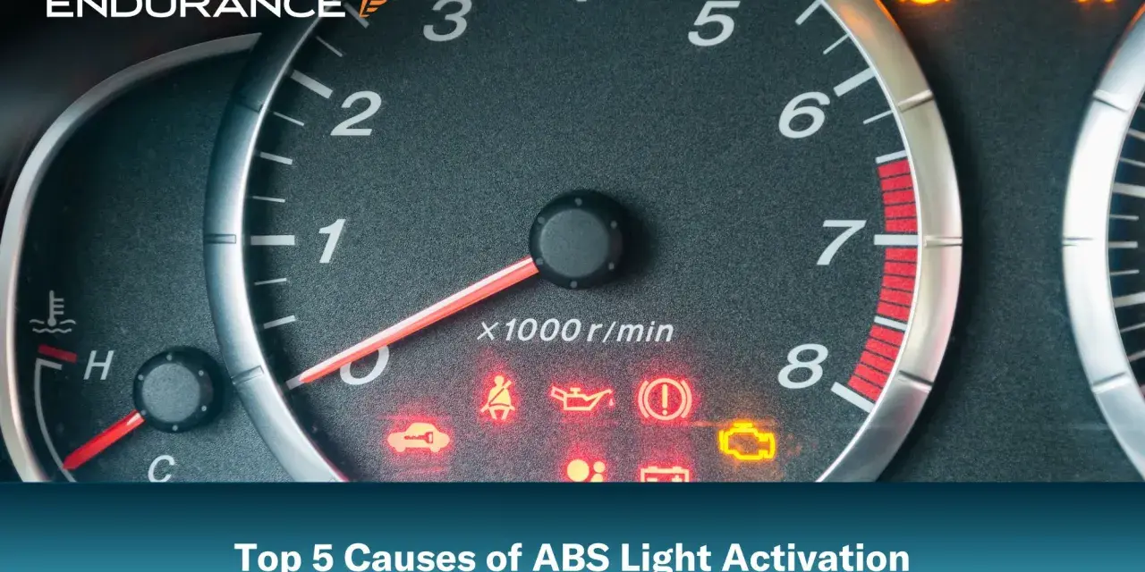 Dashboard with illuminated ABS light and other warning indicators. Learn the top 5 causes of ABS light activation.