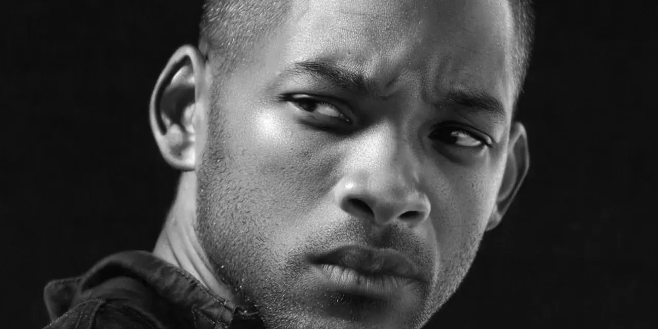 Portrait en noir et blanc d'un homme au regard intense, le dessin le plus réaliste du monde.