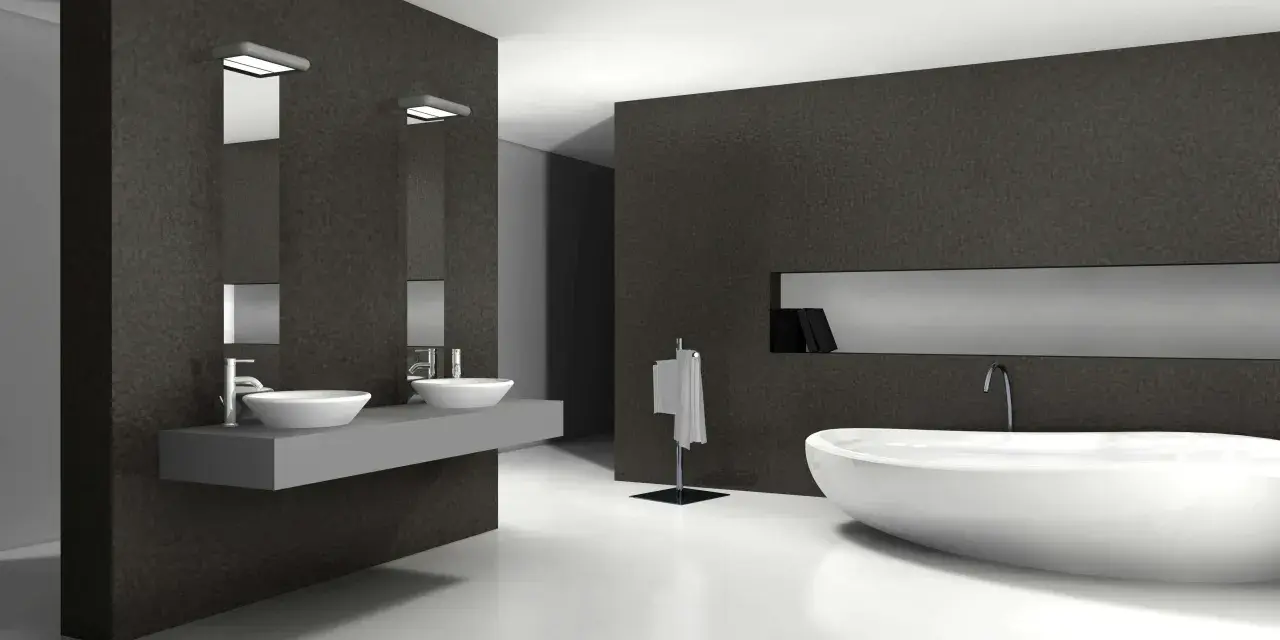 Élégante salle de bain blanc et noir avec baignoire îlot, double vasque et porte-serviettes.