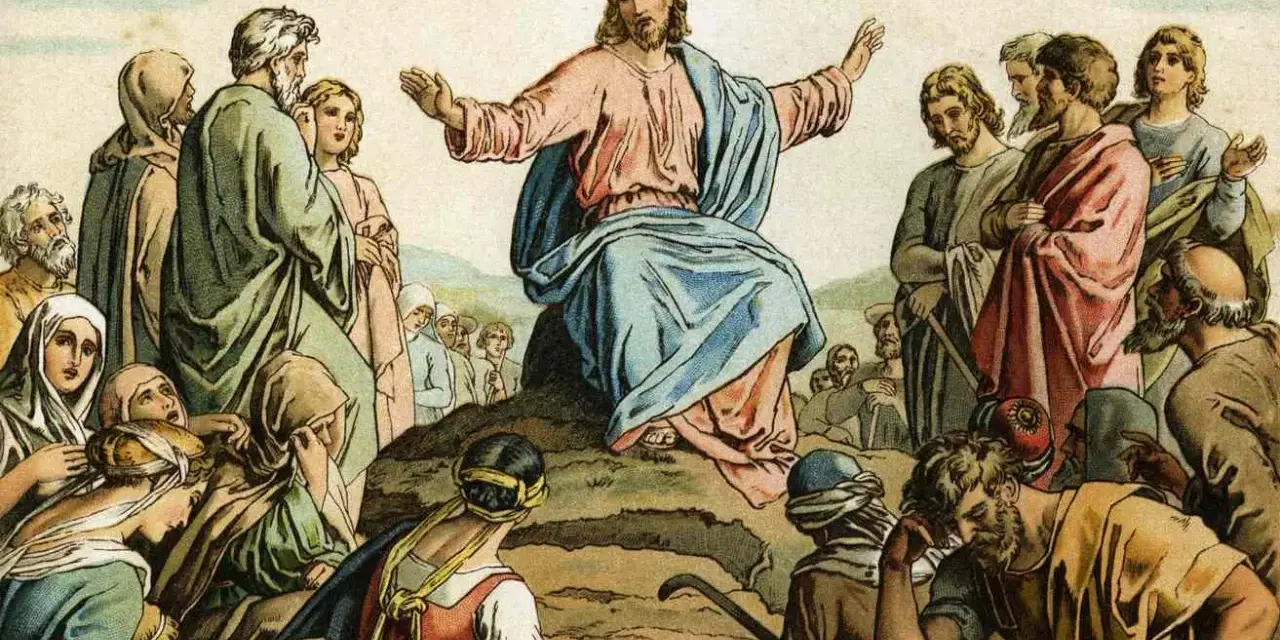 Jesus preaches the Beatitudes Catholic to a crowd gathered on a hillside, his arms outstretched in blessing.