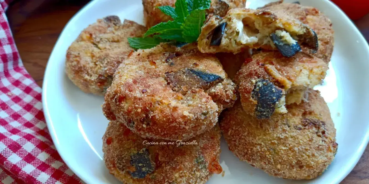 Polpette di melanzane in friggitrice ad aria, dorate e croccanti, con un ripieno filante. Perfette per un antipasto o un secondo leggero.