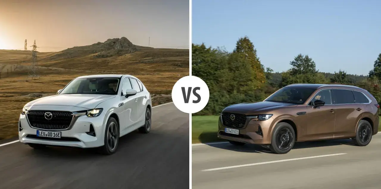 Dwa SUV-y Mazda CX-80: biały i brązowy, z napisem "VS" pośrodku.