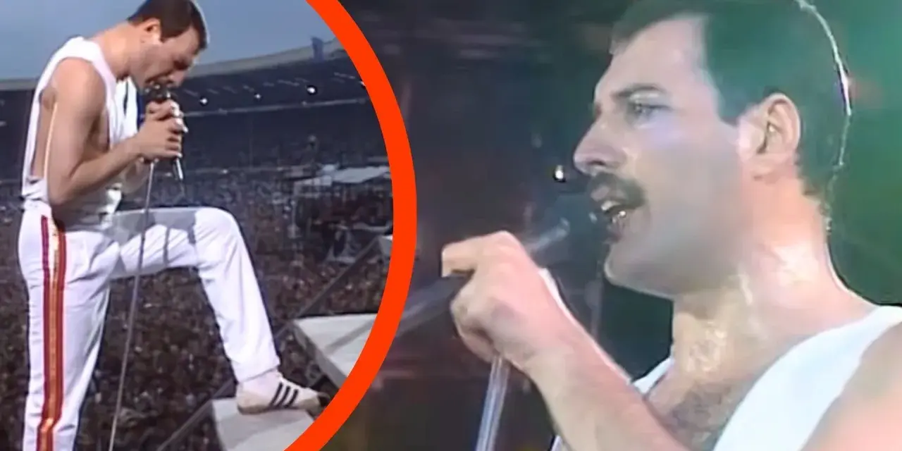 Freddie Mercury w białym stroju, z mikrofonem w dłoni, na tle tłumu. To mógł być jego ostatni koncert.