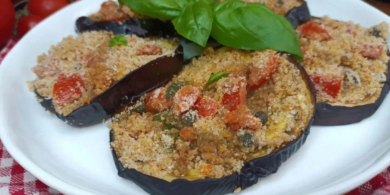 Melanzane ripiene in friggitrice ad aria, un piatto gustoso e leggero. Pomodorini, capperi e basilico per un ripieno saporito.