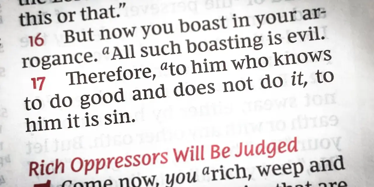 Close-up of a Bible page, showing text about the sin of omission: "to him who knows to do good and does not do it, to him it is sin.