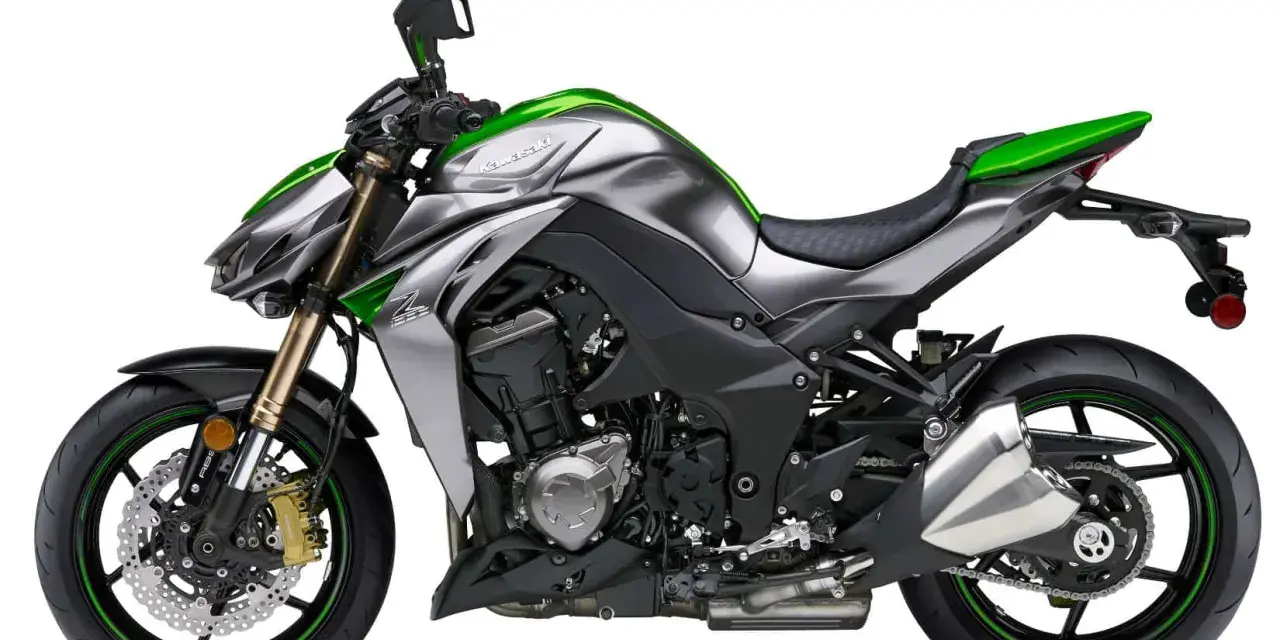 Srebrno-zielony Kawasaki Z1000 z agresywnym designem, gotowy do podboju dróg.
