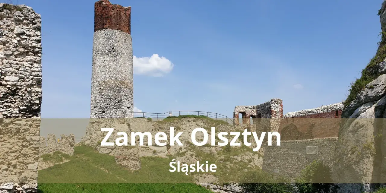 Zamek Olsztyn, ruiny średniowiecznej warowni na Jurze Krakowsko-Częstochowskiej, dumnie wznosi się na tle błękitnego nieba.