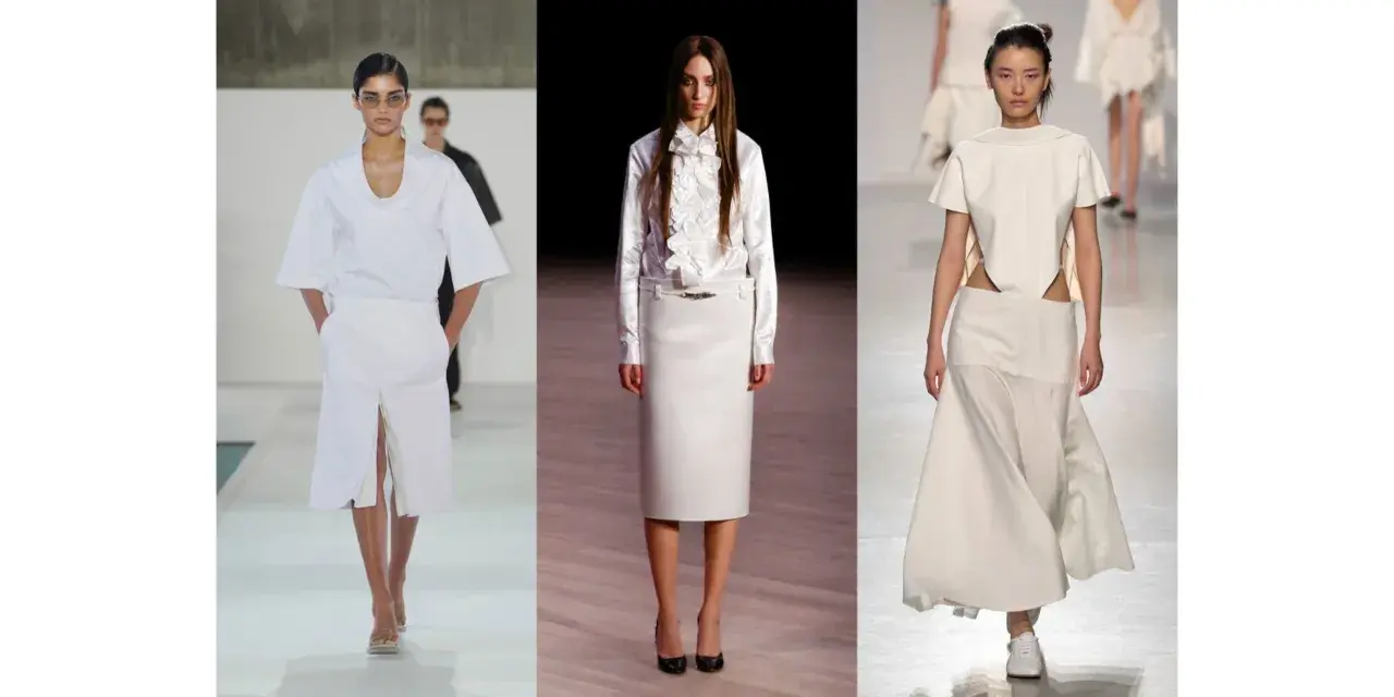 Sfilata di moda con tre modelle che indossano abiti eleganti in **dress code total white**. Gonne lunghe e top asimmetrici.