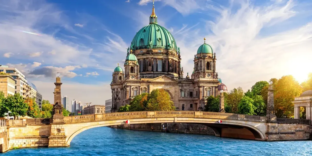 A stunning view of Berlin Cathedral across the Spree River, perfect for your next travel to Berlin.