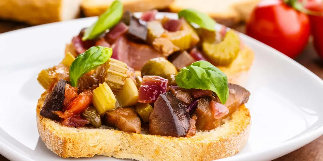Bruschetta garnie d'un mélange coloré de légumes, évoquant les délices de Capoue.