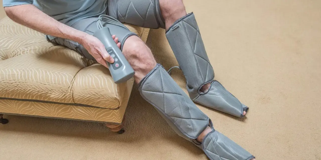 Man using a leg compression machine, enjoying the benefits of improved circulation and muscle recovery.