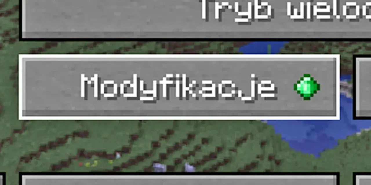 Ekran gry Minecraft z przyciskiem "Modyfikacje" i zielonym szmaragdem.