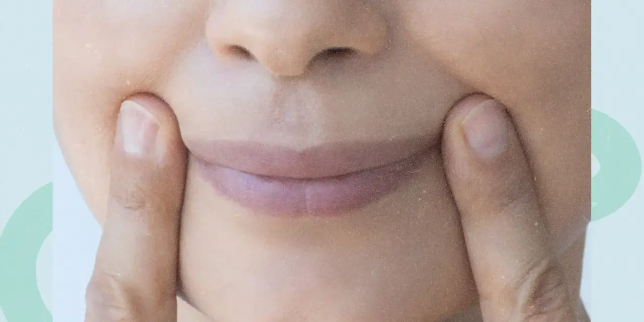 Fingers press into the cheeks, creating dimples. Could this be one of the unexpected side effects of face yoga?