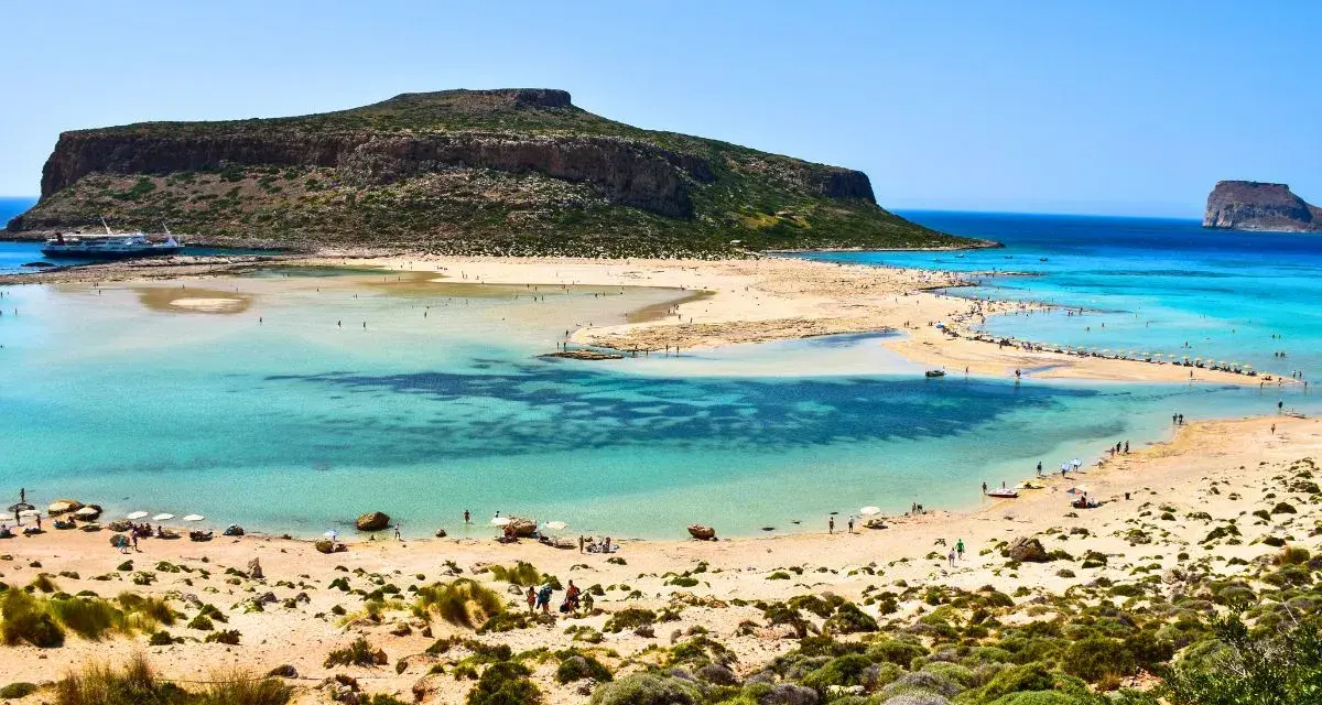 Balos Lagoon, Crete, Greece: turquoise waters, sandy beaches, and a dramatic island backdrop make this the best island in Greece for a perfect beach day.