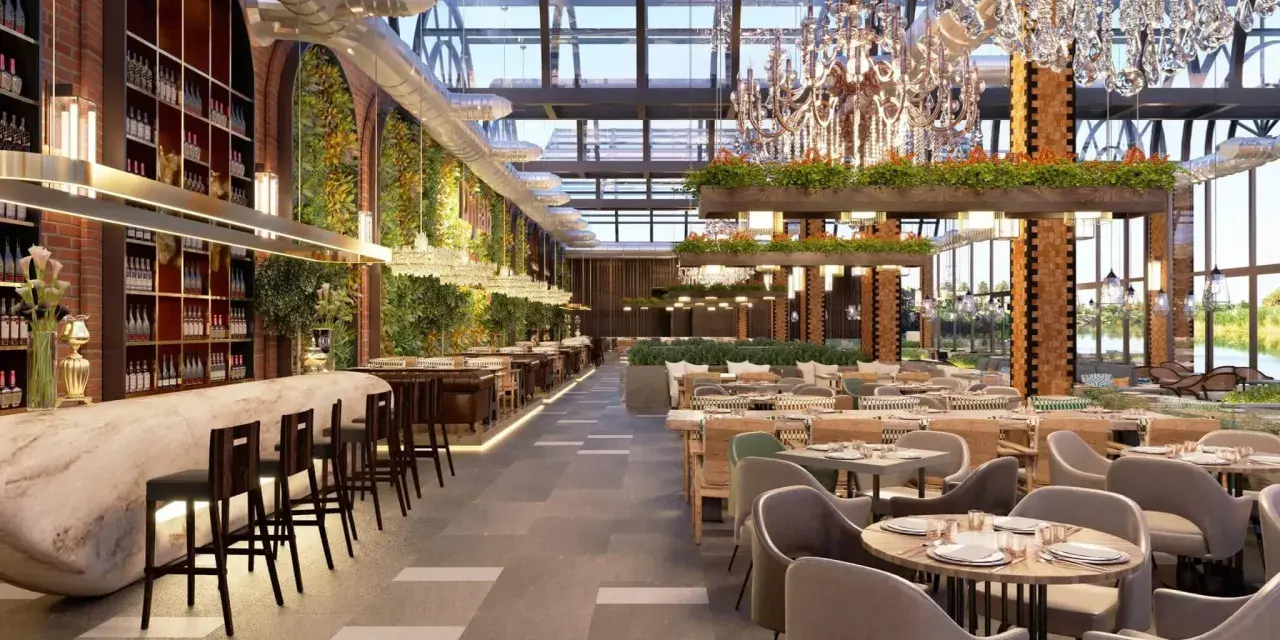 Interior de bar moderno con barra de mármol, estanterías de vino, vegetación y lámparas de araña. Ideal para la licencia apertura bar.